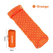 Orange outdoor camping inflatable mattress with built-in pillow and compact storage bag, lightweight and durable design for easy portability and comfort.
