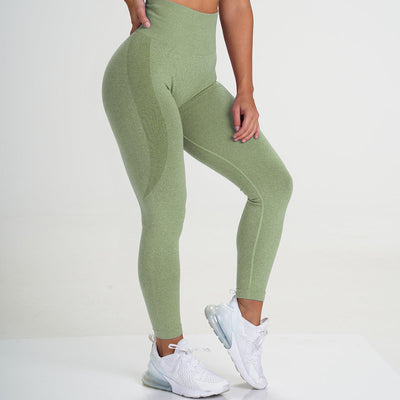 High-waisted peach hip yoga pants with hip-lifting, stretch fabric in green.