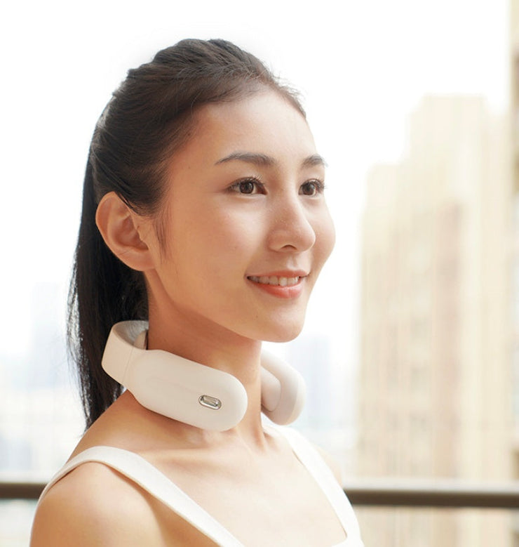 Cervical & Shoulder Massager on woman’s neck, white color, sleek design, remote control use.