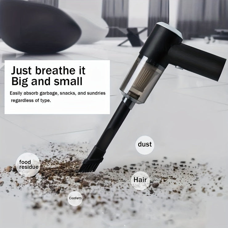 Portable car vacuum cleaning dust and debris on floor.