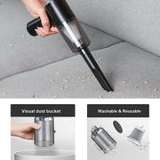 Portable car vacuum cleaner in use on a sofa, showcasing its powerful suction and washable, reusable filter.