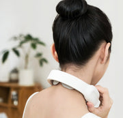Cervical and shoulder massager being used by a woman, providing relaxation and pain relief.