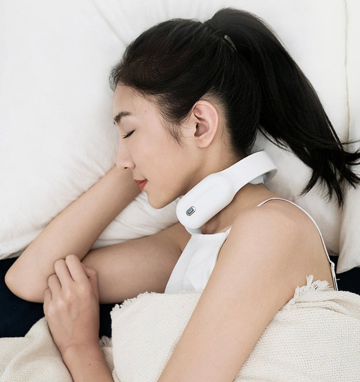 Cervical and shoulder massager in use while woman sleeps.