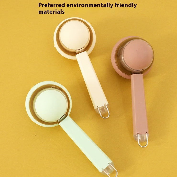 Silicone pet massage brushes in beige, brown, and green with long handles on a yellow background.