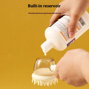 Silicone pet massage brush with built-in reservoir being filled with shower gel.