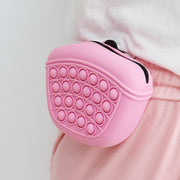 Silicone dog treat pouch clipped to waist, pink, food-grade, portable, easy access and cleaning.