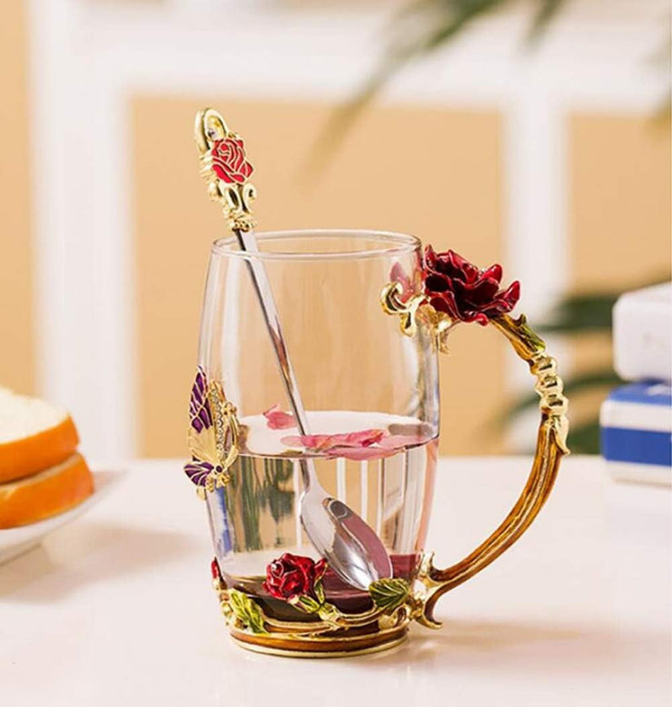 Elegant floral tea mug set with spoon and decorative enamel handle, perfect for gifts and various beverages.