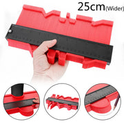 Hand holding a red contour gauge with a black measuring ruler for precise shape duplication and measurement up to 25 cm width