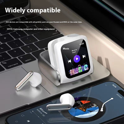 Full touch screen Bluetooth headset with noise reduction on a desk with a laptop and smartphone.
