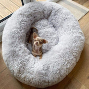 Super soft dog bed with plush cushioning and a small dog resting inside.