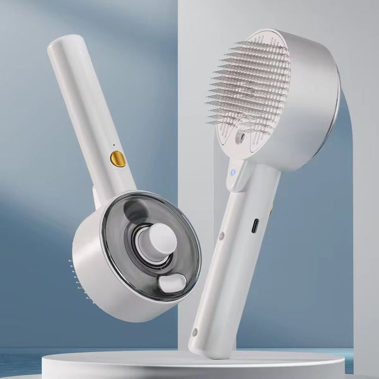 Cat and dog steamy brush with electric sprayer for pet grooming and massage.