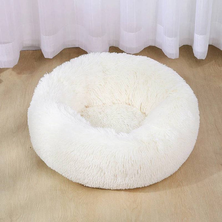 Ultra-soft dog bed with plush cushioning for comfort on hardwood floor.