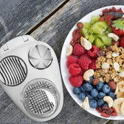 3in1 creative egg slicer and vegetable slicer on wooden table next to fruit and nuts.