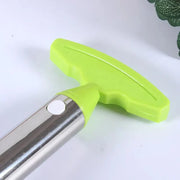 Stainless steel pineapple slicer with green handle for easy and eco-friendly fruit cutting in kitchens.