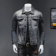 Men's denim jacket with vintage wash, distressed look, slim fit, and long sleeves for casual wear.