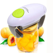 Automatic jar opener with electric mechanism in white and green, placed on a jar of peaches, surrounded by whole peaches.