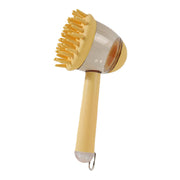 Massage brush for pets in yellow with silicone bristles and liquid reservoir for bathing.