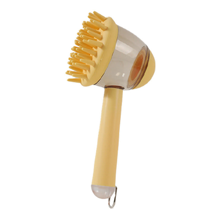 Massage brush for pets in yellow with silicone bristles and liquid reservoir for bathing.