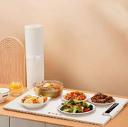 Fast Heating Food Electric Warming Tray with various dishes, featuring sleek design and adjustable temperature controls.